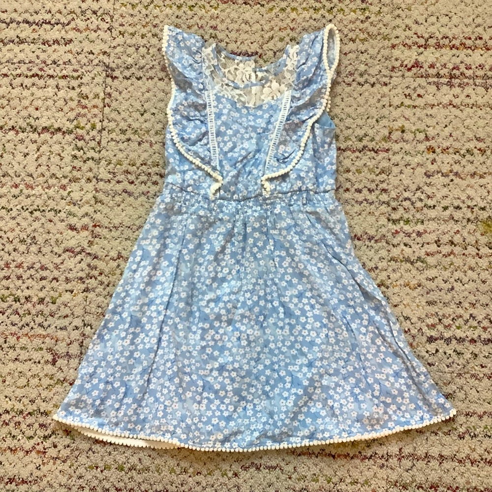 Blue summer dress with lace and small pompom detail